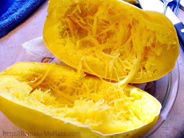 the inside of a microwaved spaghetti squash that has been cut open to expose the strands inside
