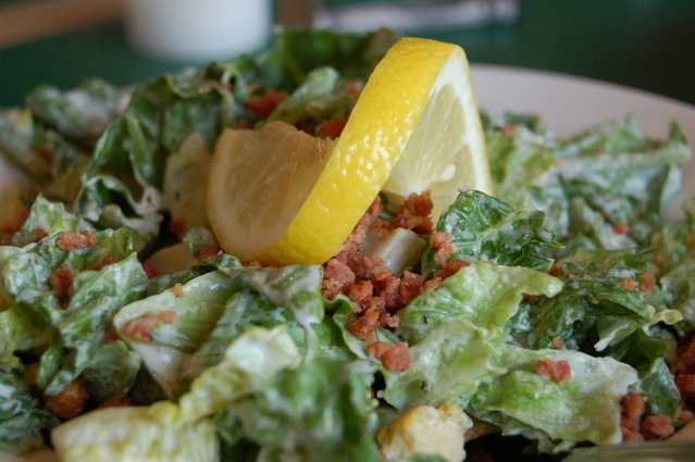 plate of salad topped with dressing