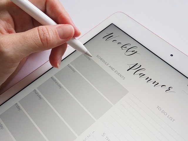 Filling out a digital meal planner on a tablet