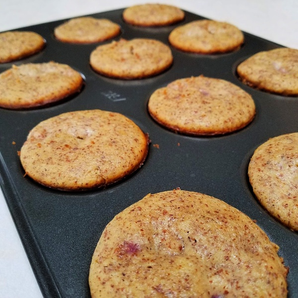 raspberry muffin tops in baking sheet