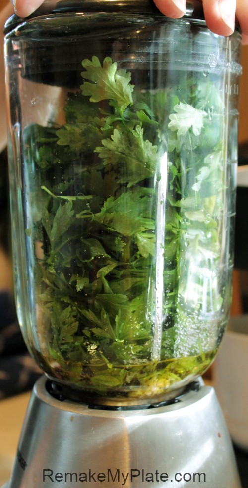 cilantro and basil in a blender
