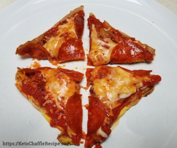 Keto Chaffle Pizza. keto chaffle recipe makes a delicious bread and waffle replacement and only 1.1 net grams of carbs #chaffles #ketochaffles #chafflerecipes #ketogenic #ketorecipes #ketochafflerecipe #remakemyplate