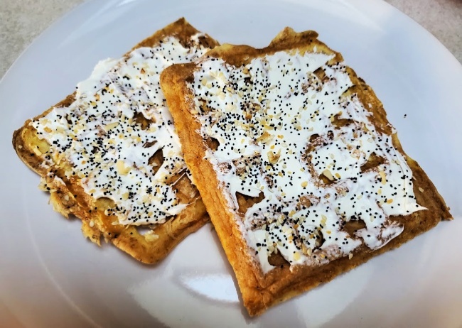 Top your favorite chaffle recipe with cream cheese and a sprinkle of Everything But The Bagel seasoning mix #chaffles #EverythingSeasoning #keto #ketorecipes #remakemyplate