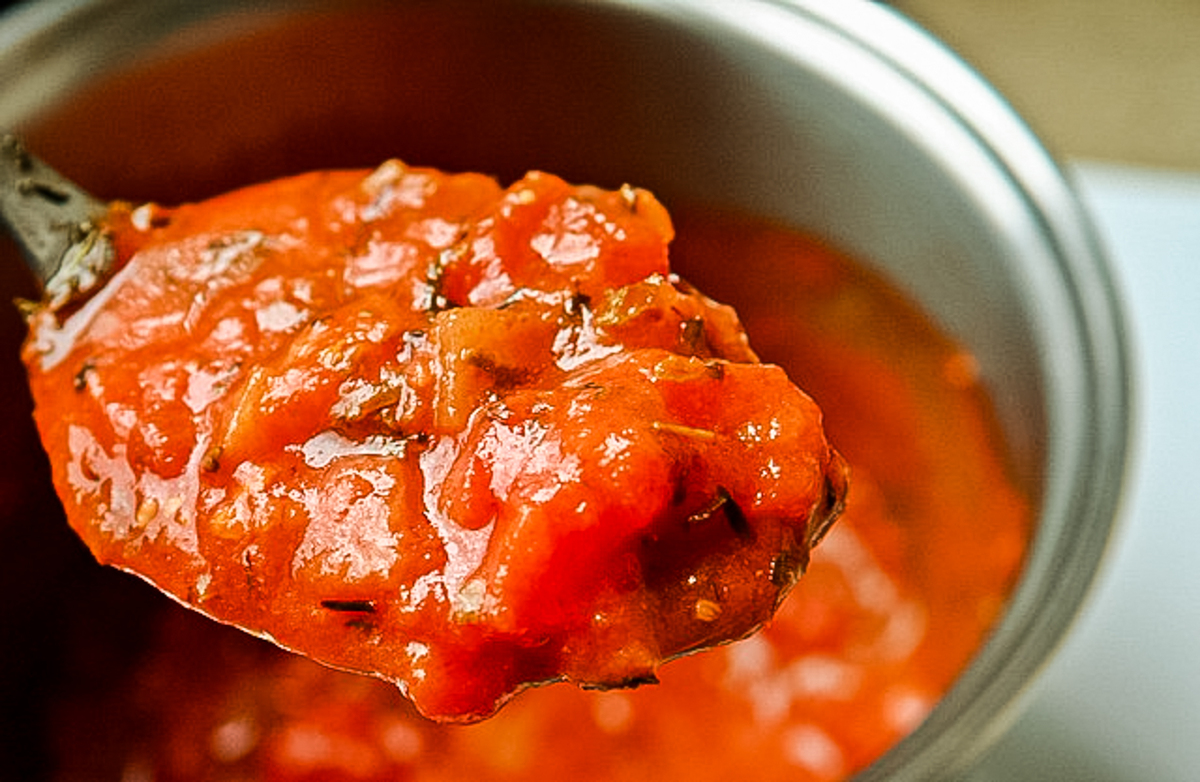 homemade low carb spaghetti sauce on a serving spoon