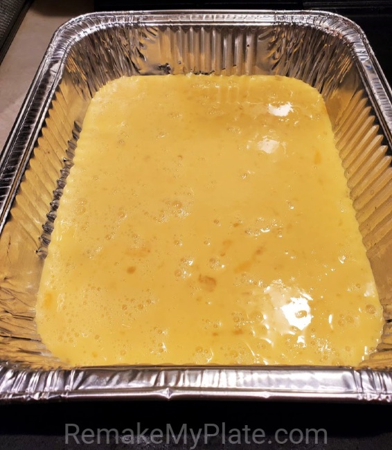 scrambled eggs poured into a pan