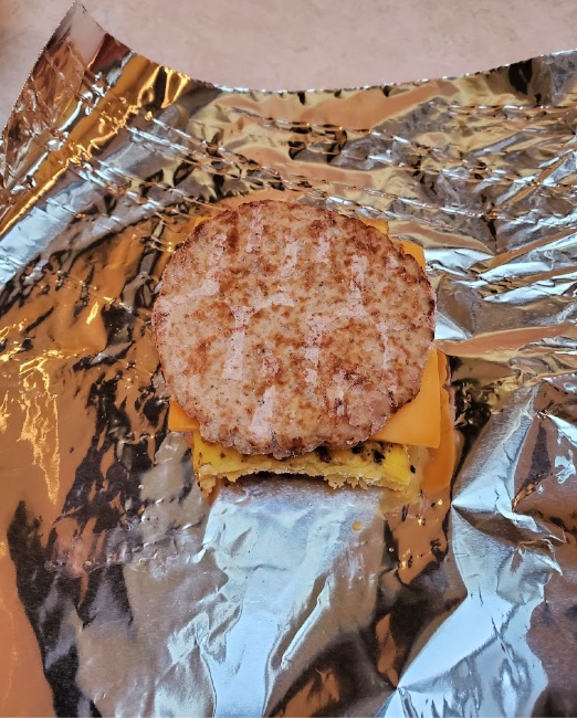 sausage patty added to the top of the sandwich