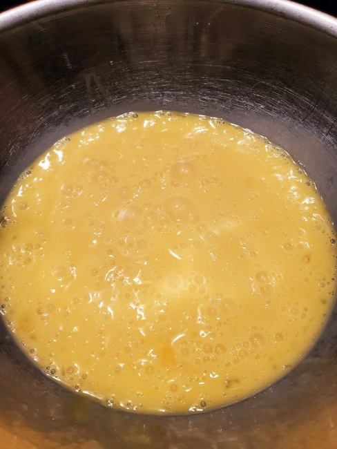 eggs scrambled in a mixing bowl