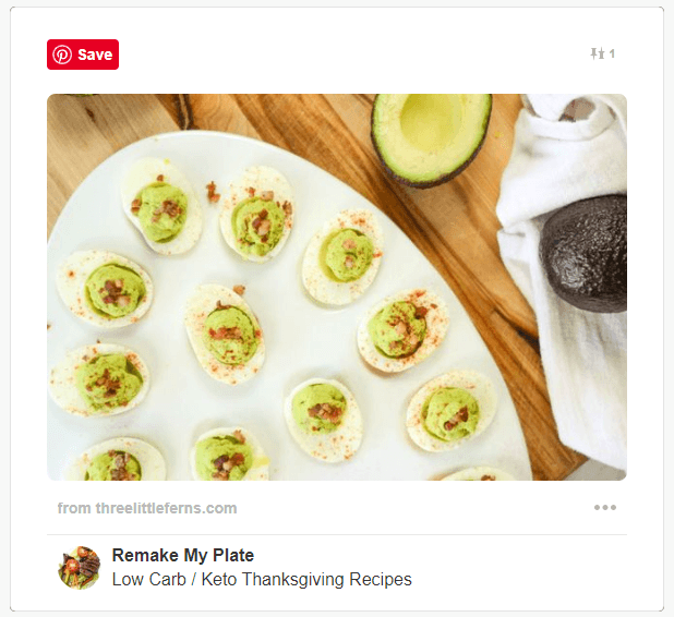 avocado deviled eggs topped with bacon on a platter