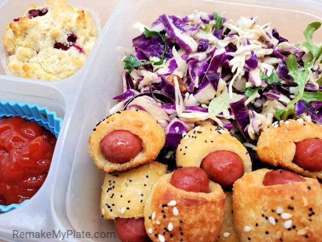 keto lunch with pigs in a blanket, coleslaw, ketchup and a muffin