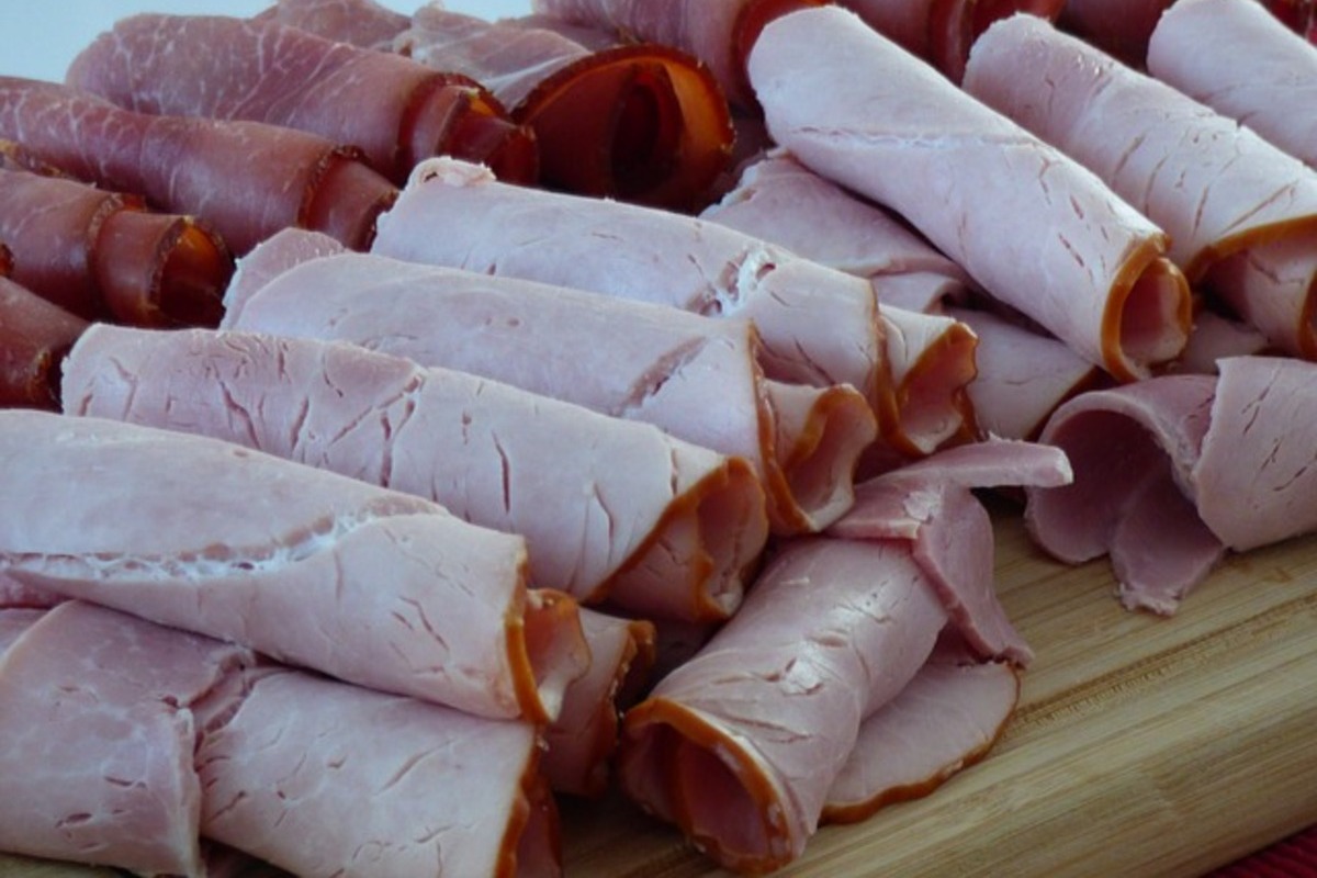 rolled up deli meat on a serving tray