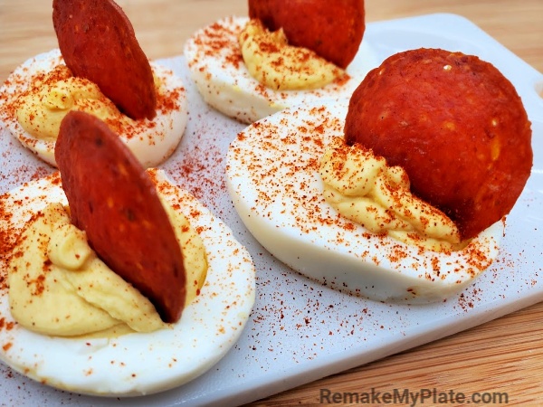 keto deviled eggs with cream cheese topped with pepperoni slices