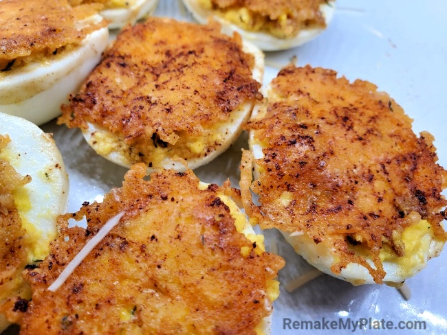 fried deviled eggs coated in Parmesan cheese