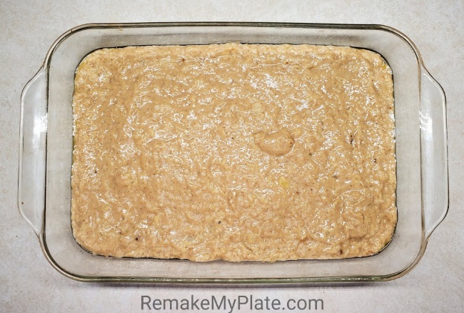 Pouring the pineapple coconut batter into the prepared baking dish.