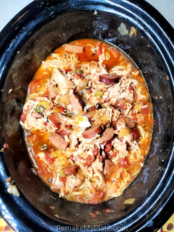 cooked keto cajun chicken and sausage in the crockpot