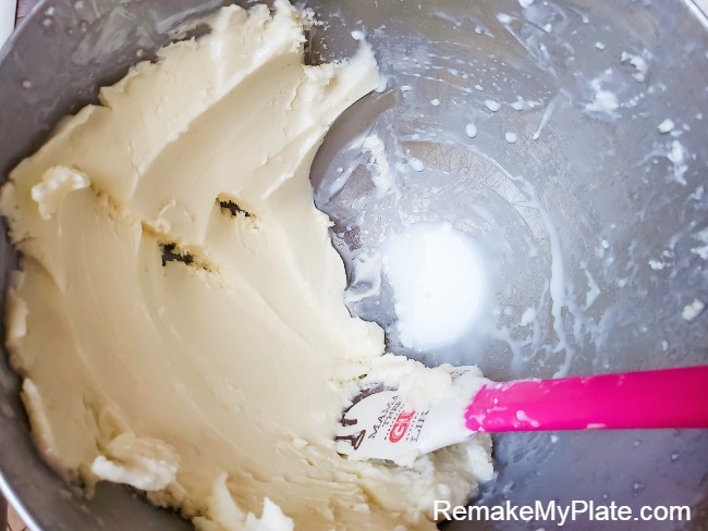 Continue to press the butter against the side of the mixing bowl until no more liquid is released