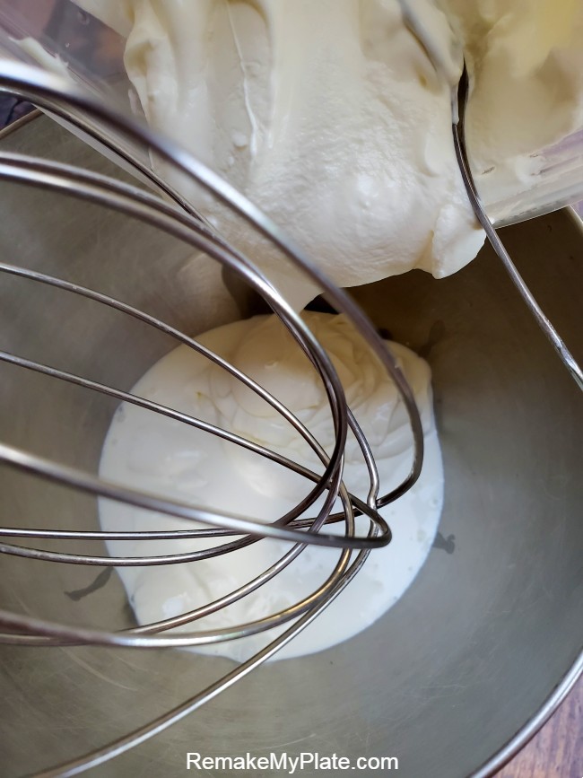 Add the cream to the mixer and attaching the whisk