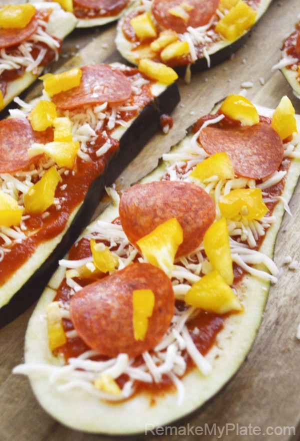 Low carb Eggplant Pizza slices topped with cheese, pepperoni and sliced peppers.