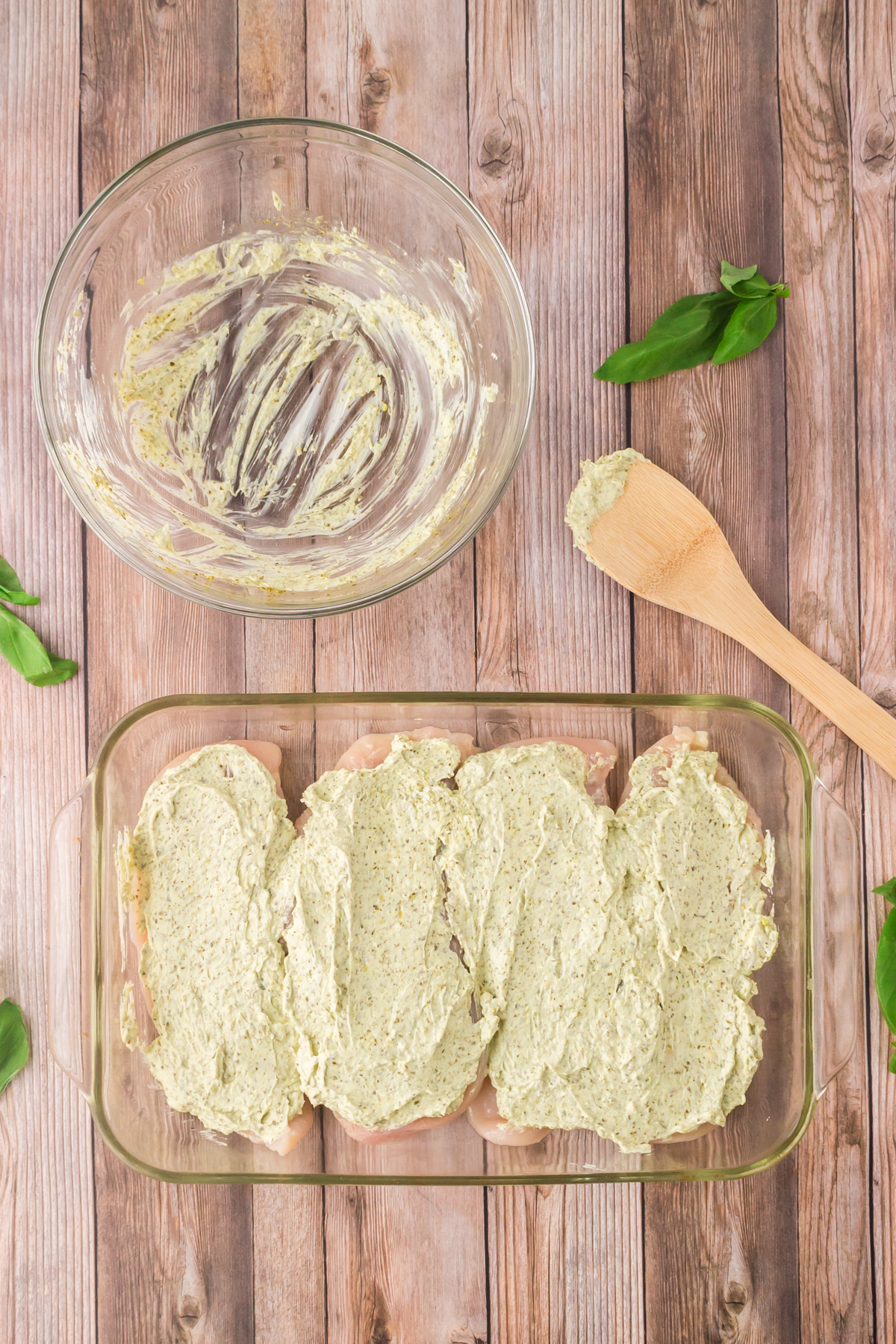 spreading the cream cheese mixture over the chicken breasts