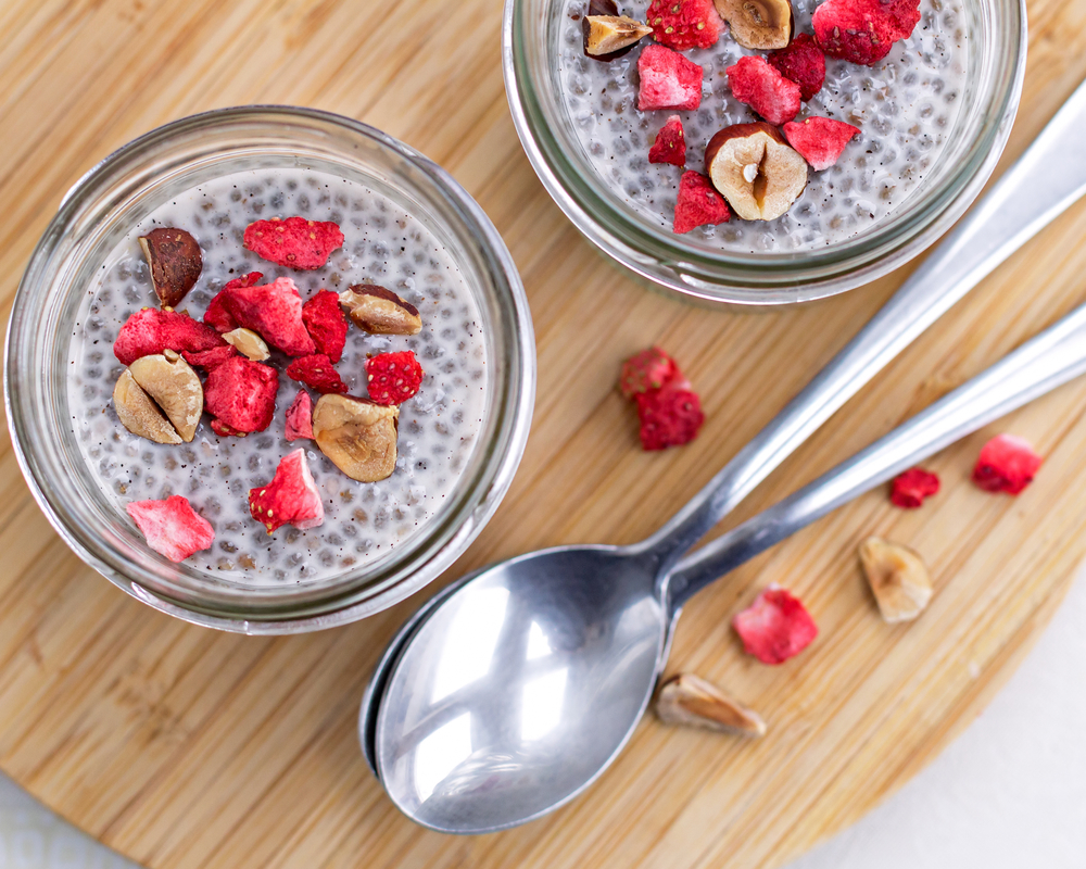 vanilla chia pudding topped with hazelnuts and freeze dried strawberries