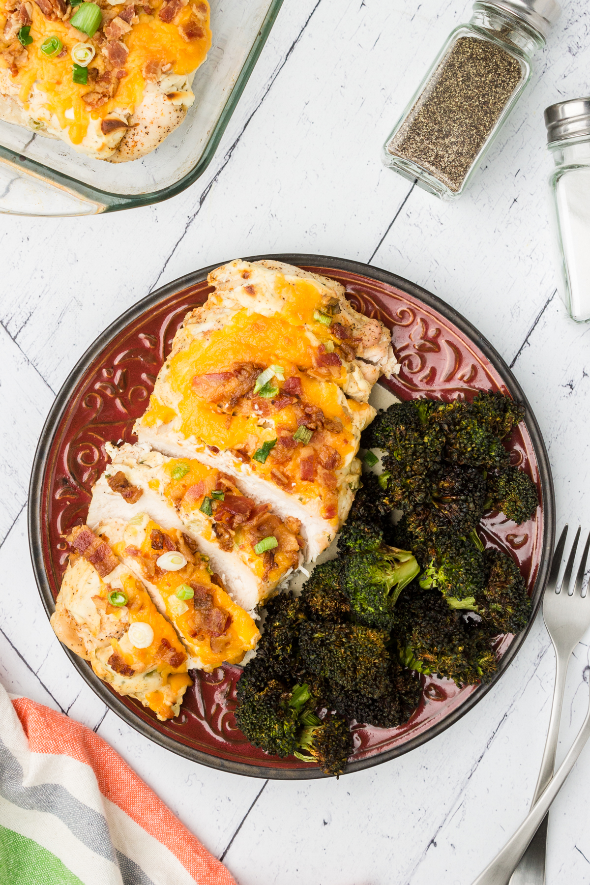 baked crack chicken on a plate with roasted broccoli side dish