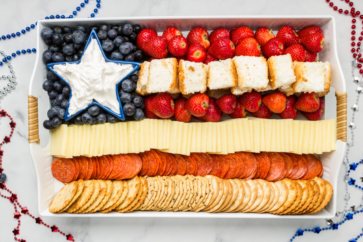 Finished flag shaped Patriotic charcuterie board on a budget displayed on a table