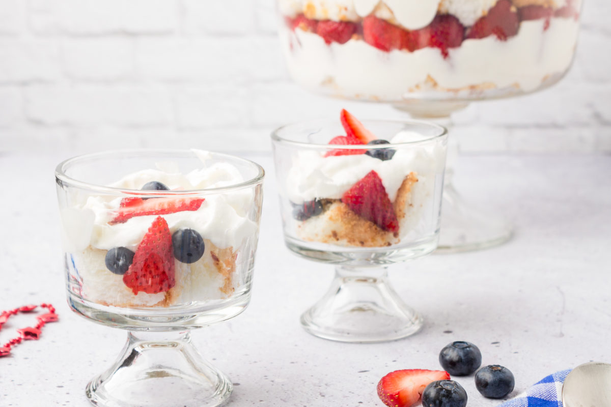 red, white and blue berry trifle served in small bowls