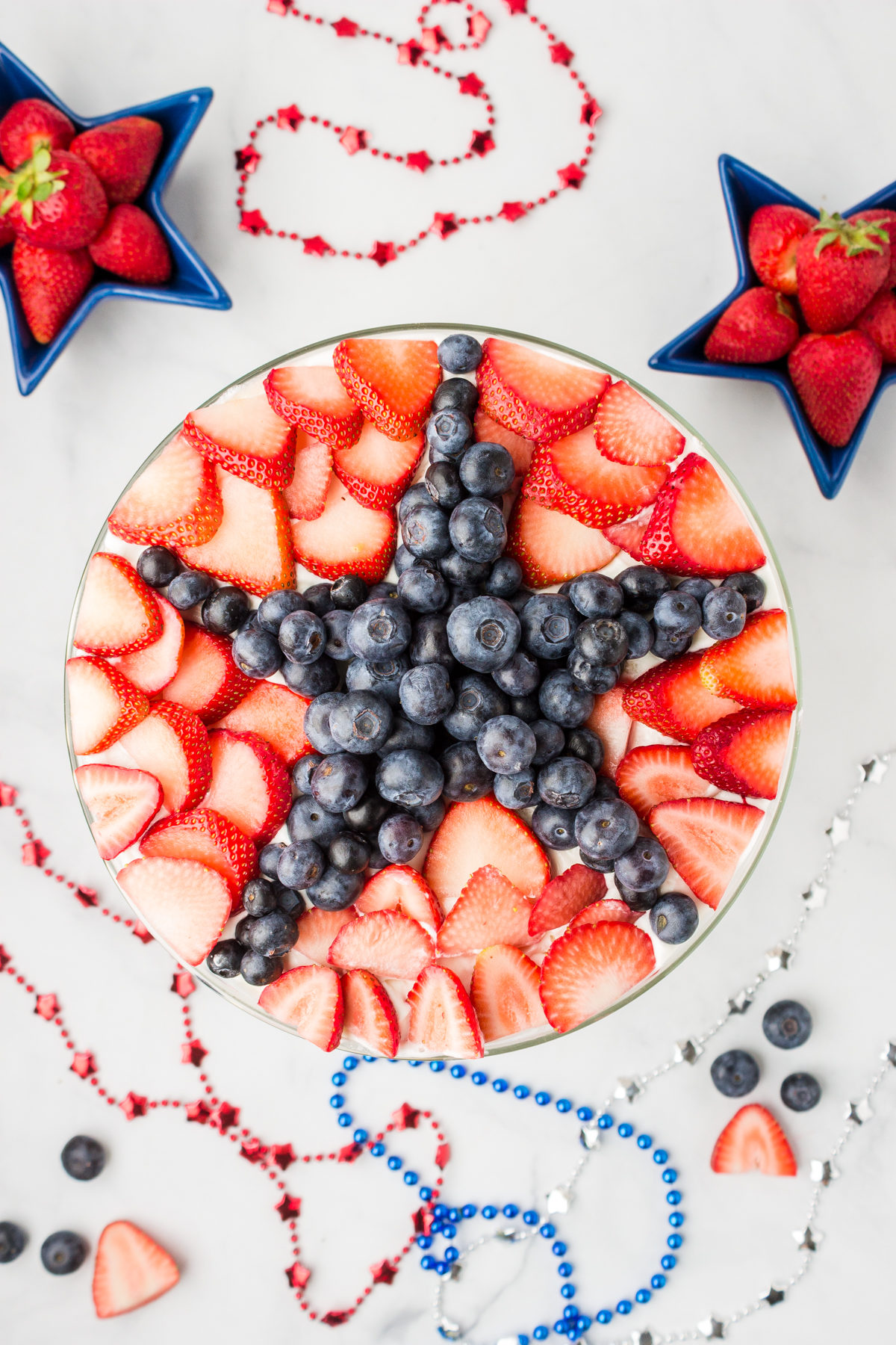 red, white and blue berry trifle with a star design on top
