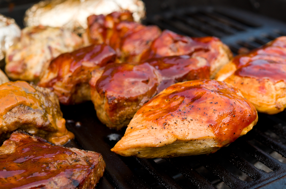 chicken breasts and chicken thighs topped with keto BBQ sauce