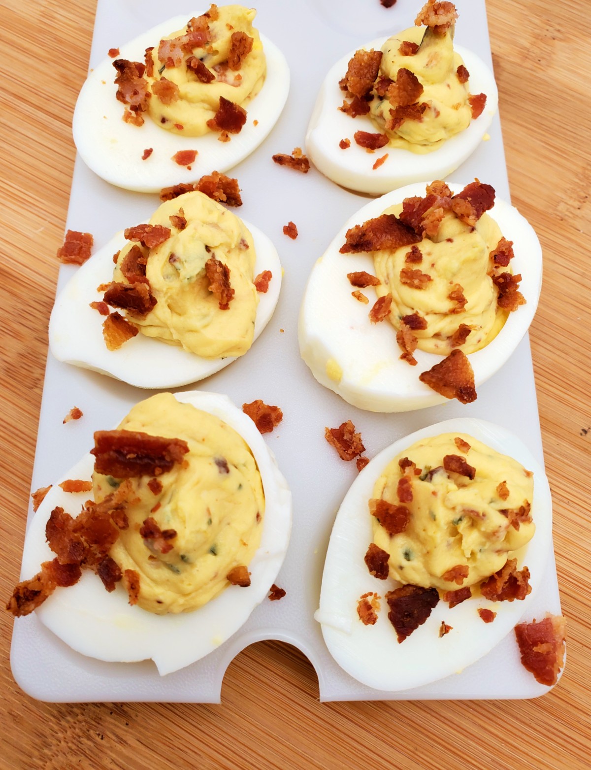 ranch deviled eggs topped with bacon bits