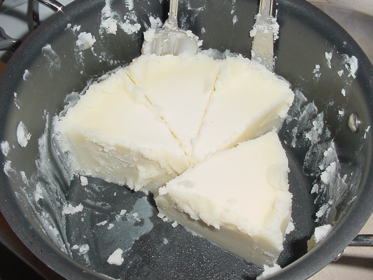Finished beef tallow pieces of beef tallow in pot