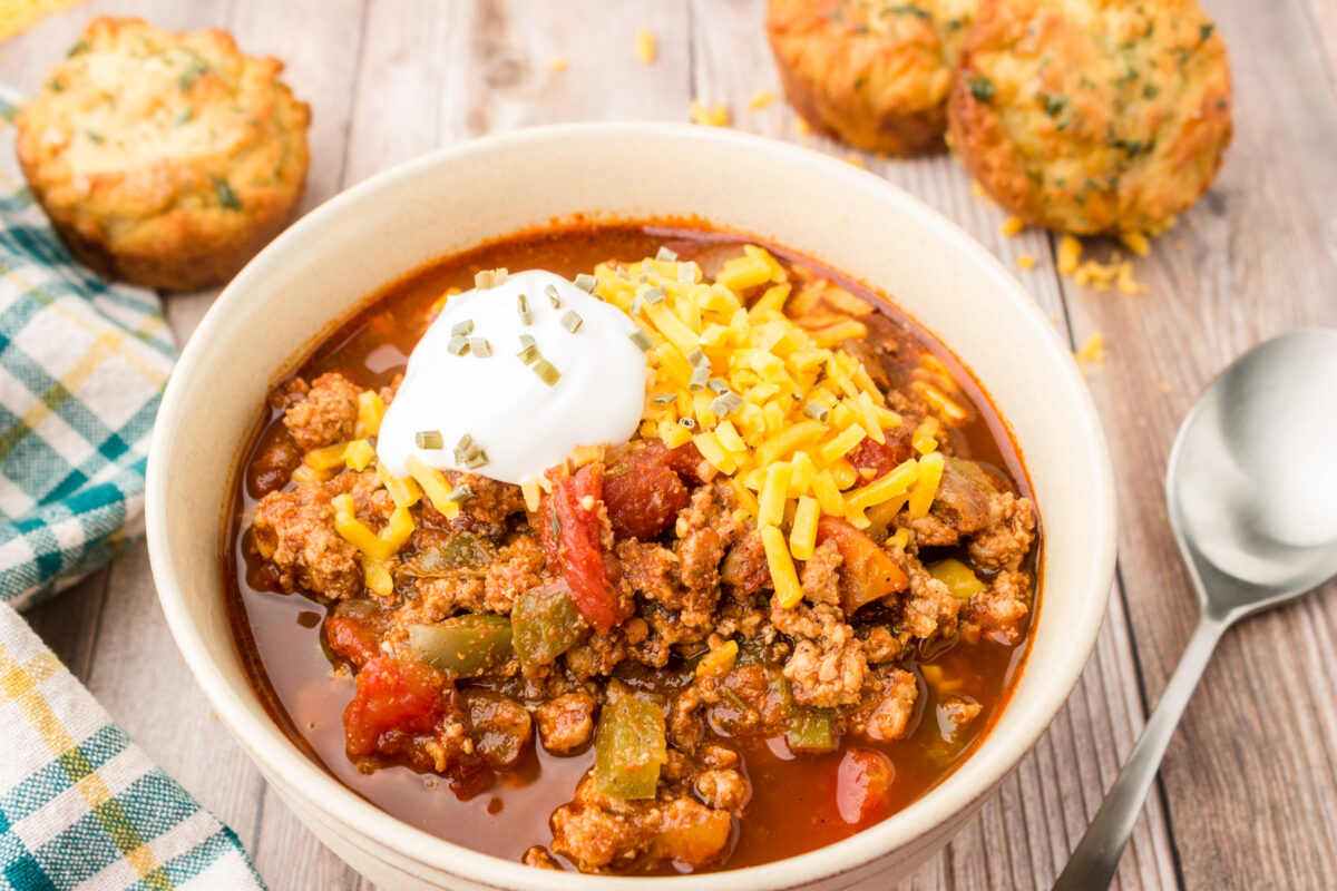 bowl of keto turkey chili with no beans served with keto cheddar biscuits