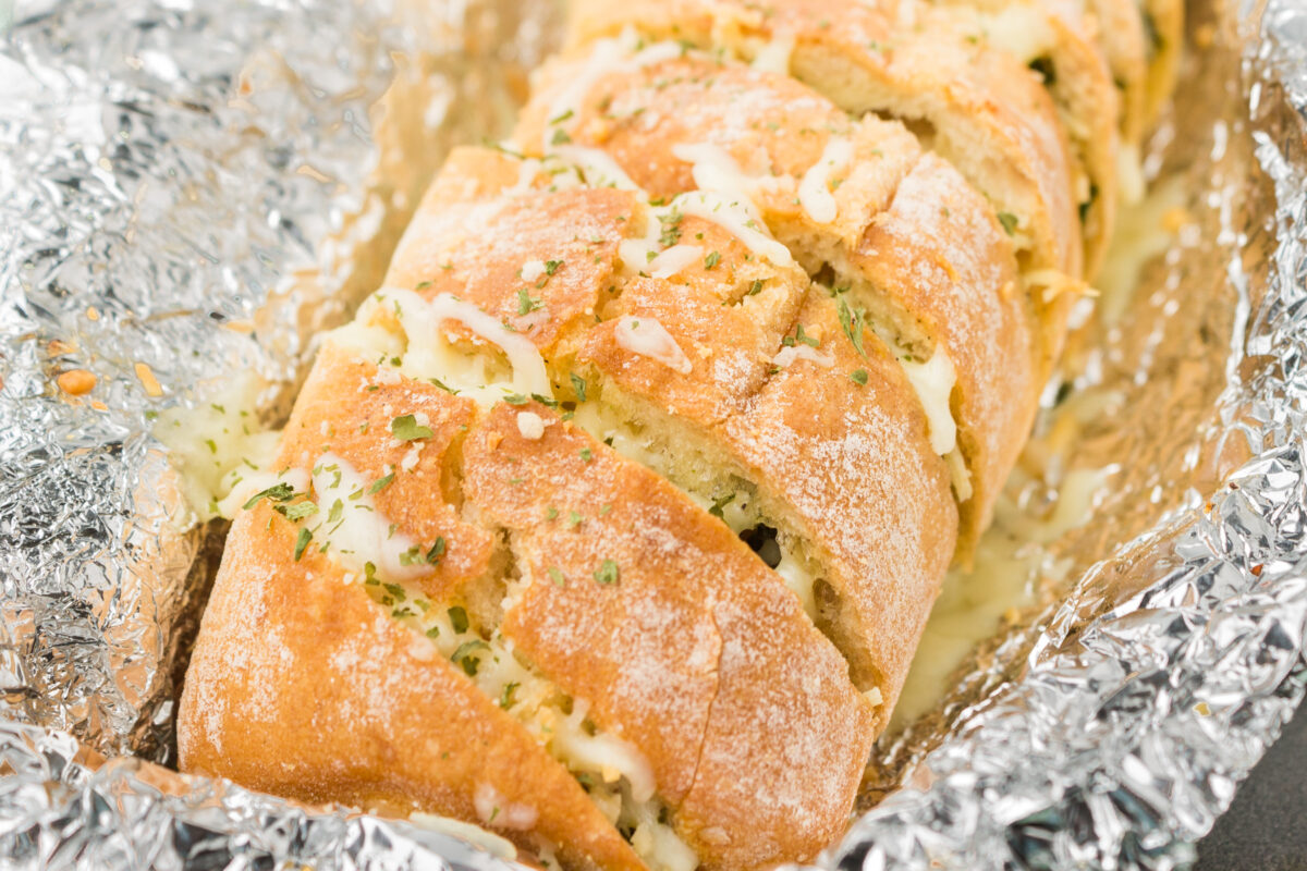 delicious cheese stuffed garlic bread baguette cut into slices