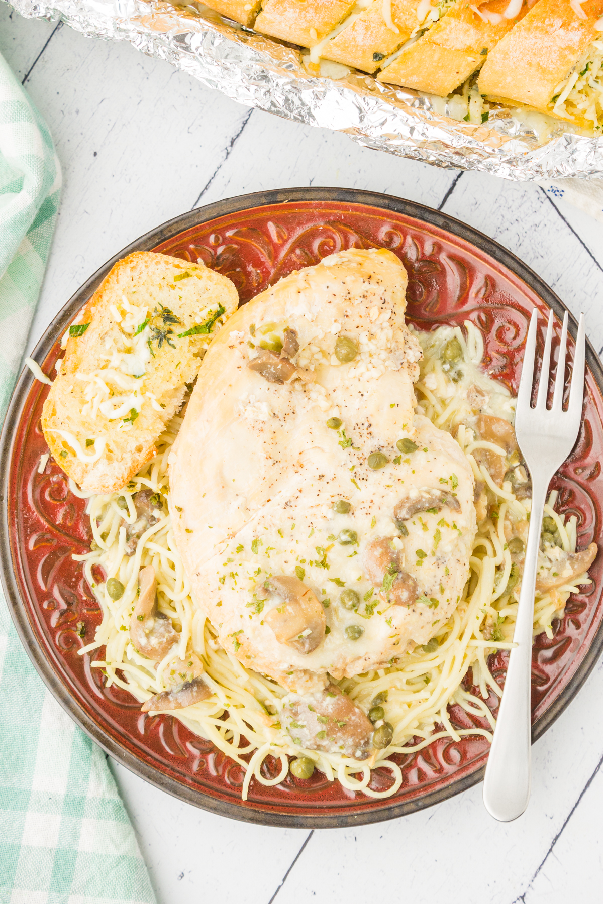 copycat cheesecake factory chicken piccata served over angel hair pasta