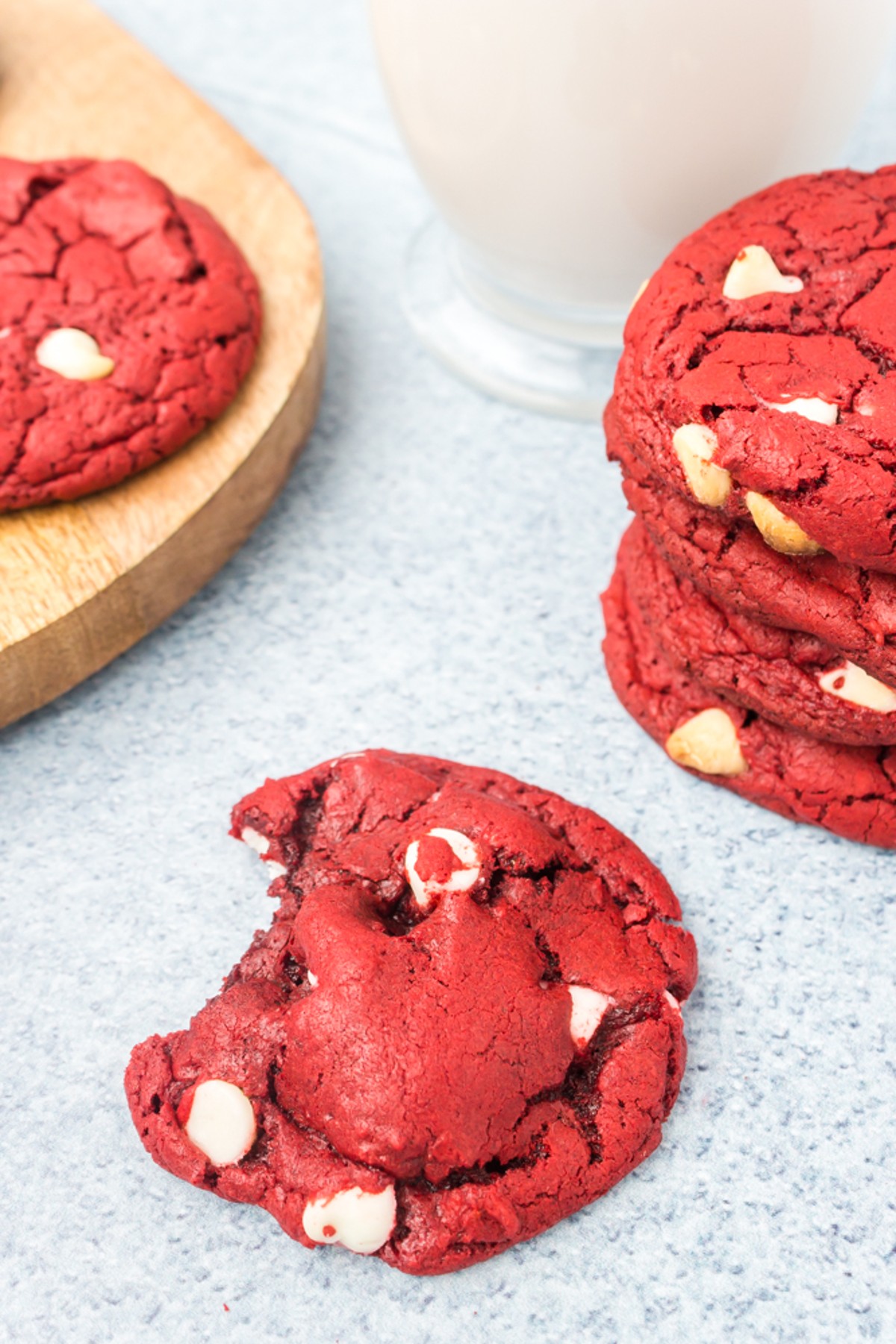 red velvet cake mix cookies with a stack of cookies