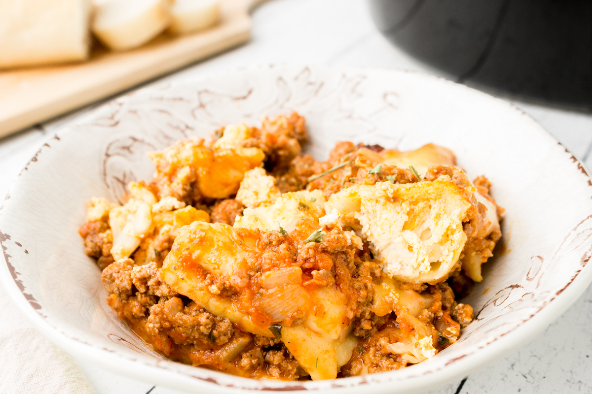 easy crockpot ravioli lasagna in a bowl