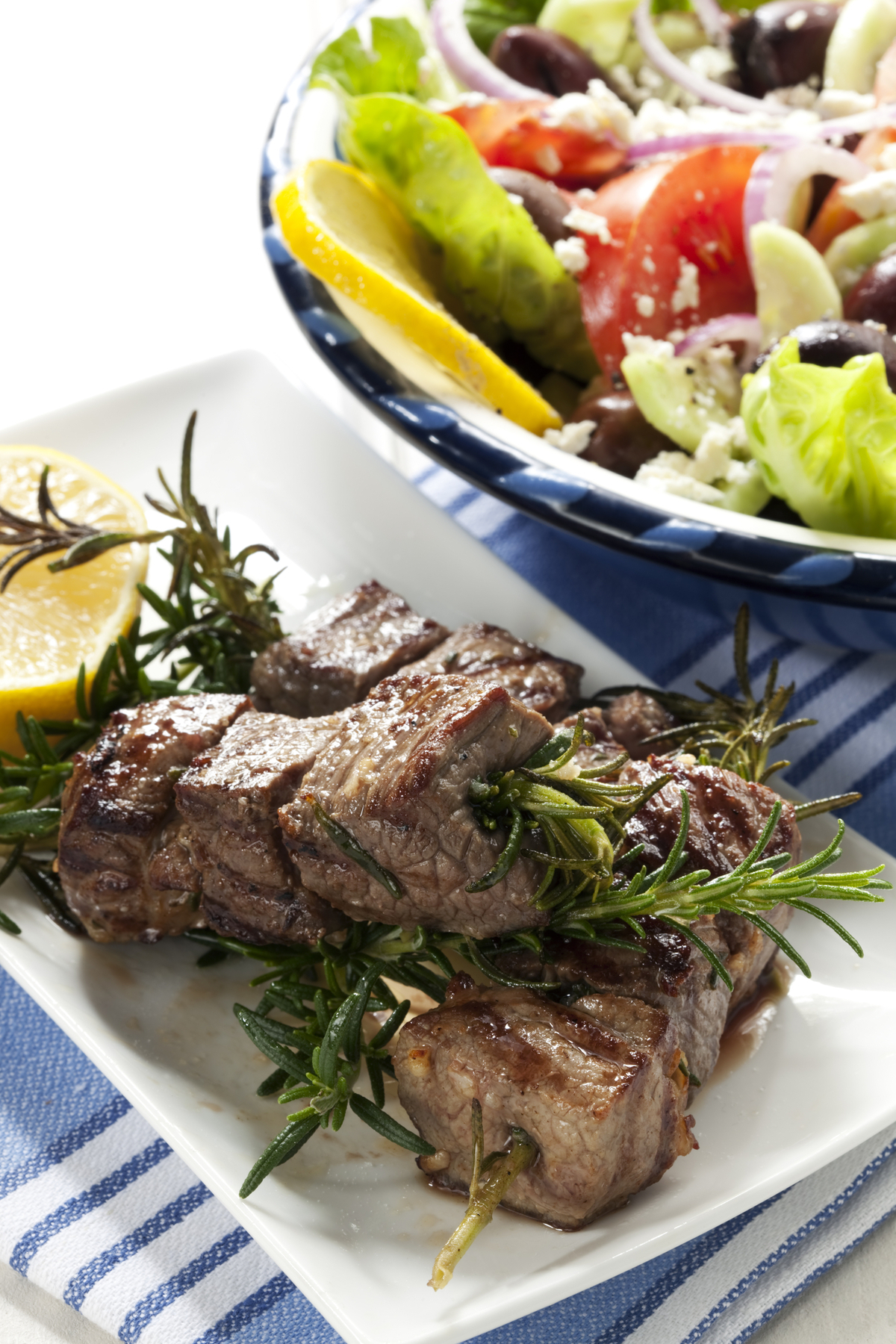 beef steak tips on rosemary skewers