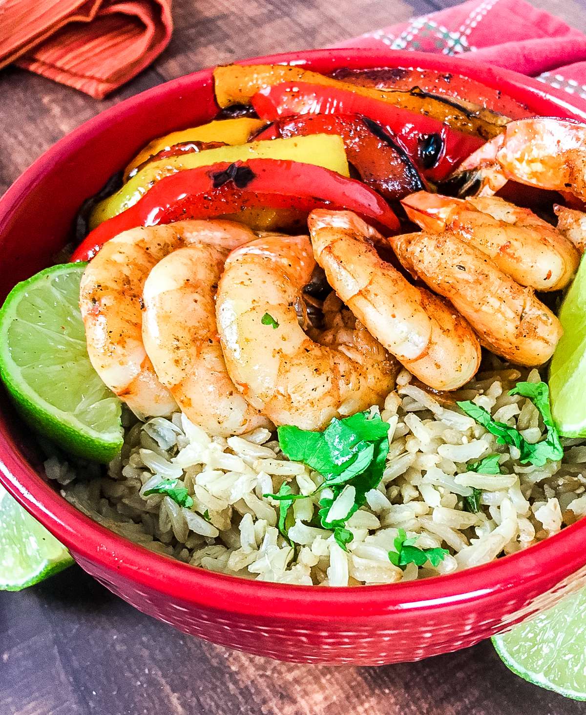cilantro lime rice topped with seasoned shrimp, grilled peppers and onions make up this shrimp fajita rice bowl