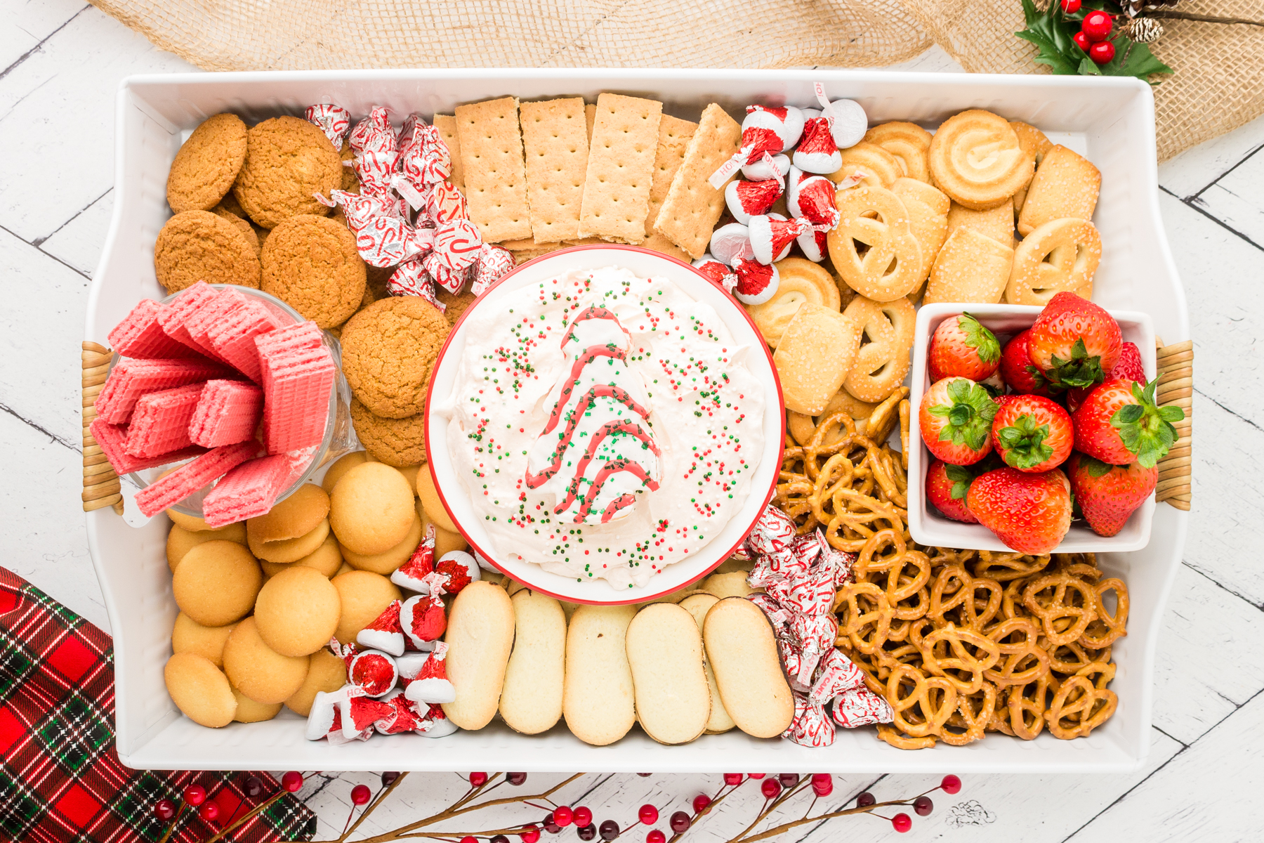 christmas dessert charcuterie board filled with dip and cookie dippers