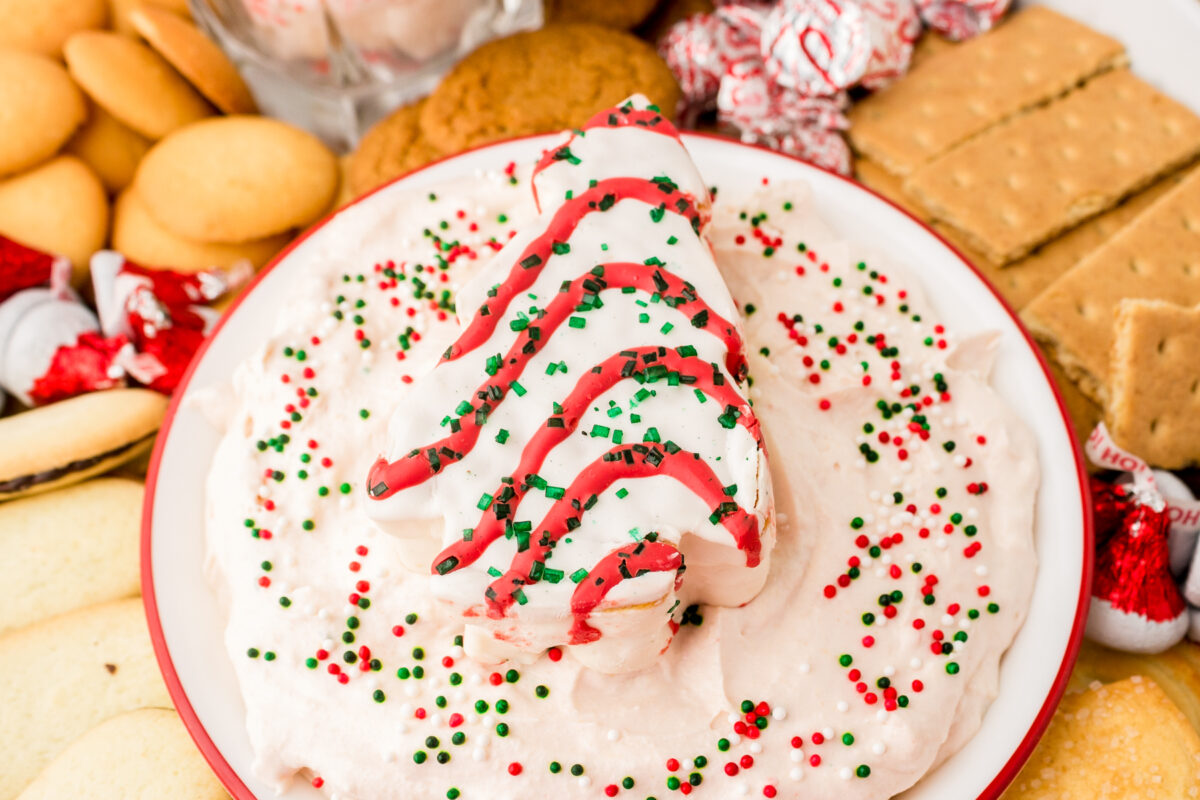Easy Christmas Tree Dip recipe made with Little Debbie Tree cake served up with a variety of cookies for dipping