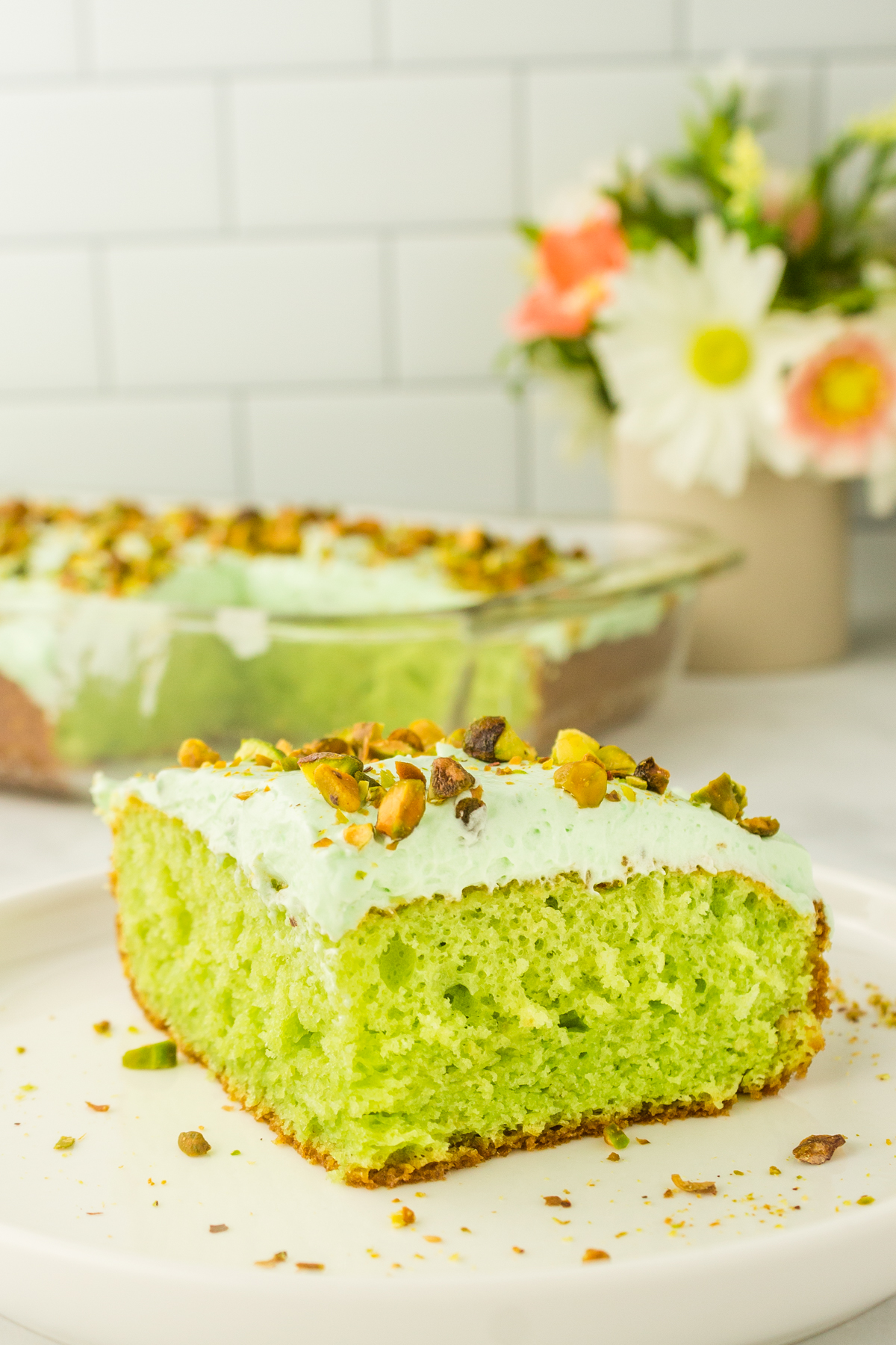 slice of pistachio cake on a plate is a simple dessert to serve