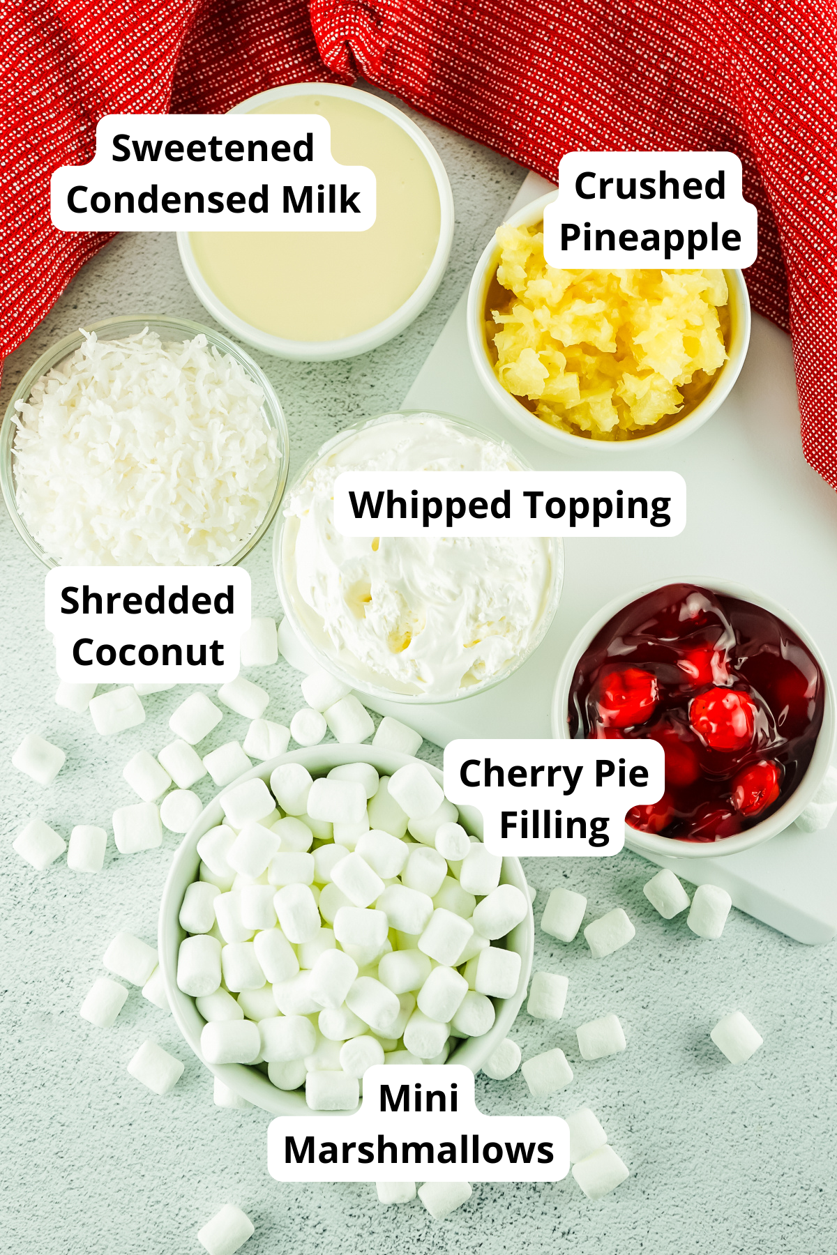 ingredients to make cherry fluff salad on a table