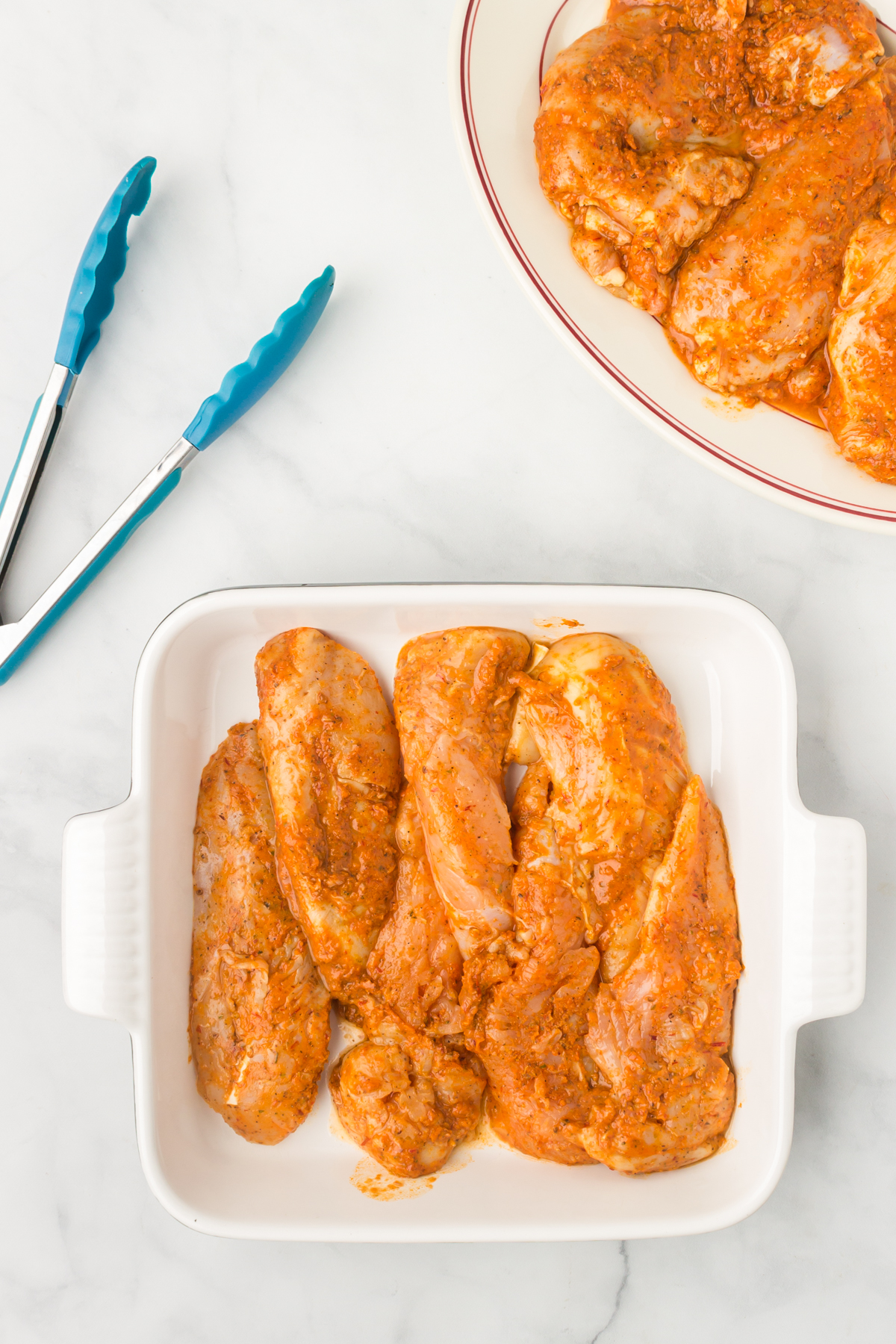 marinated chipotle chicken in a baking pan
