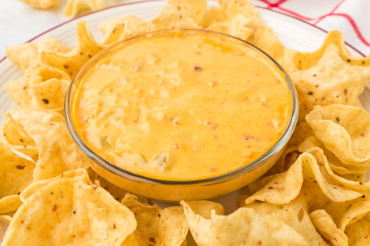 bowl of easy hormel chili cheese dip with tortilla chips
