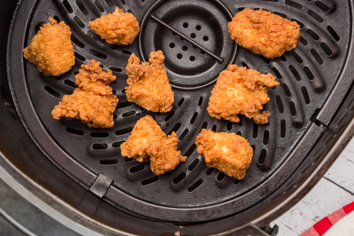 air fryer Chick-Fil A Chicken Nuggets being reheated in an air fryer
