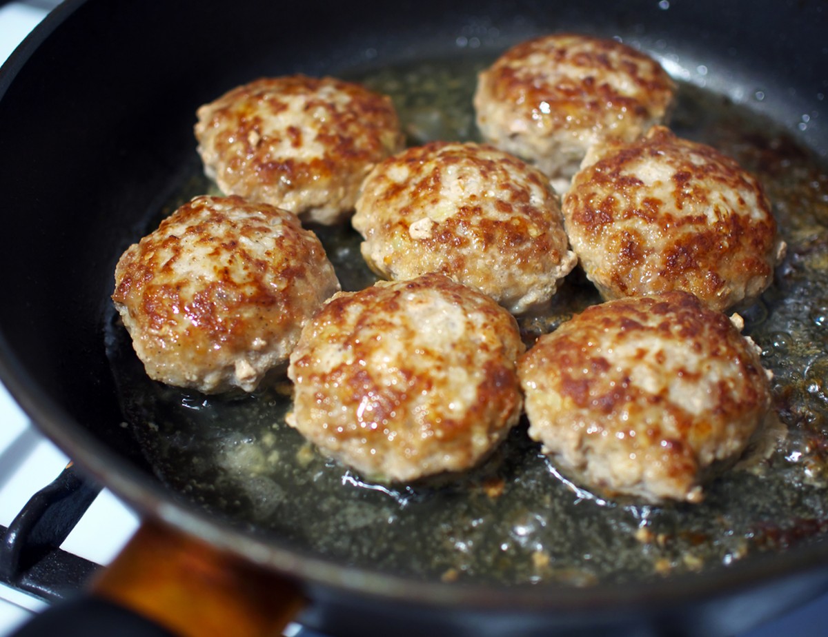 low carb breakfast sausage frying in a pan