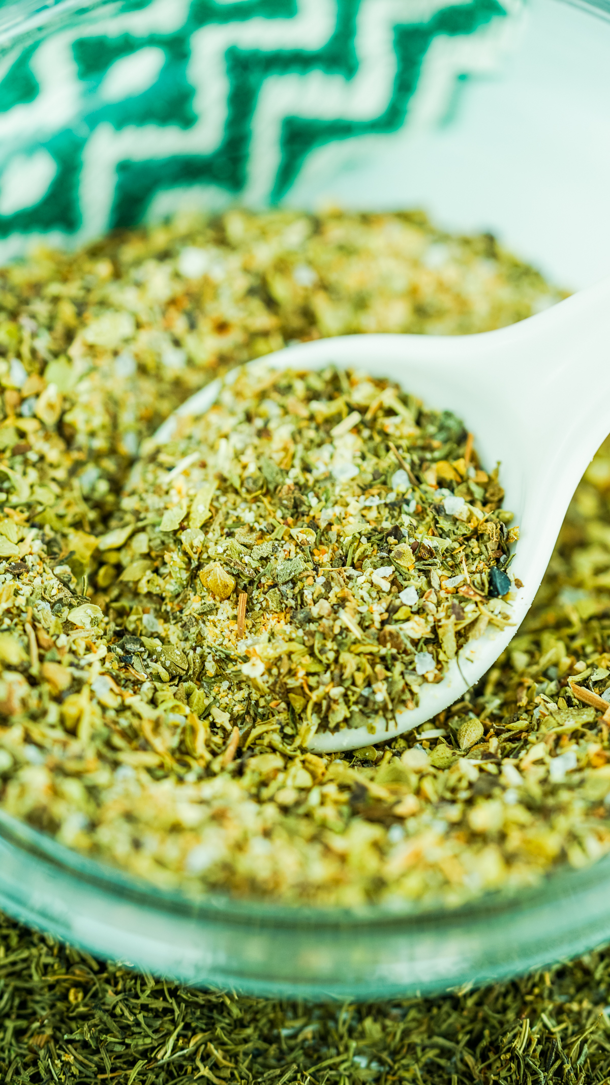 a bowl full of herbs and spices used to make Greek seasoning to help give a Mediterranean flavors to your food