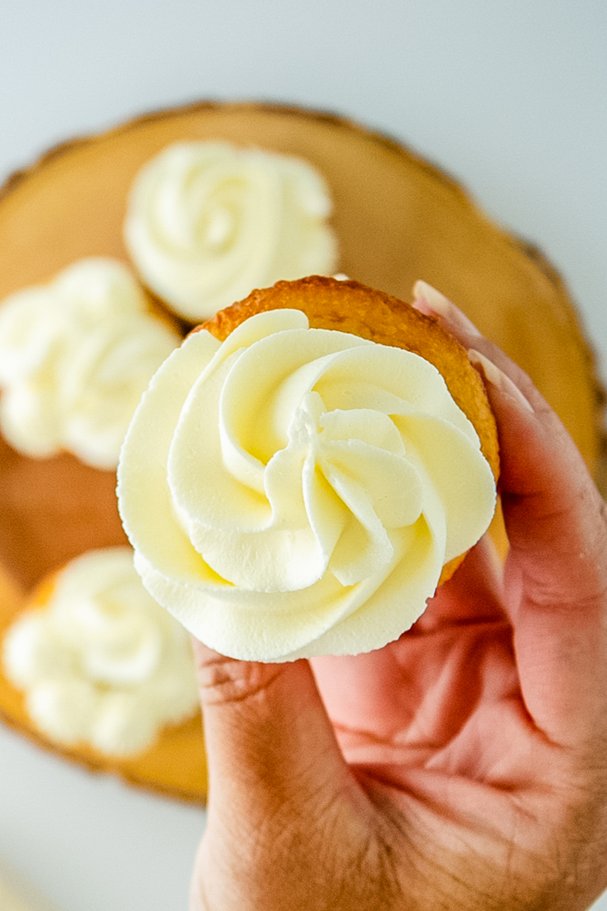 vanilla cupcake topped with American buttercream frosting