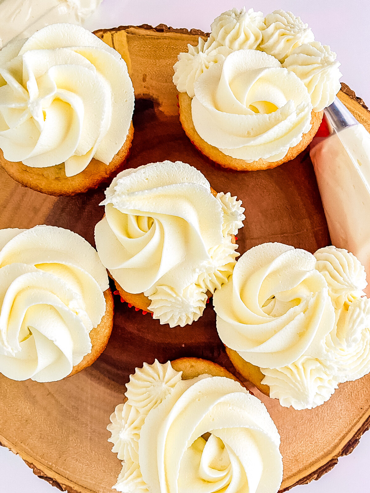  vanilla cupcakes topped with homemade buttercream frosting