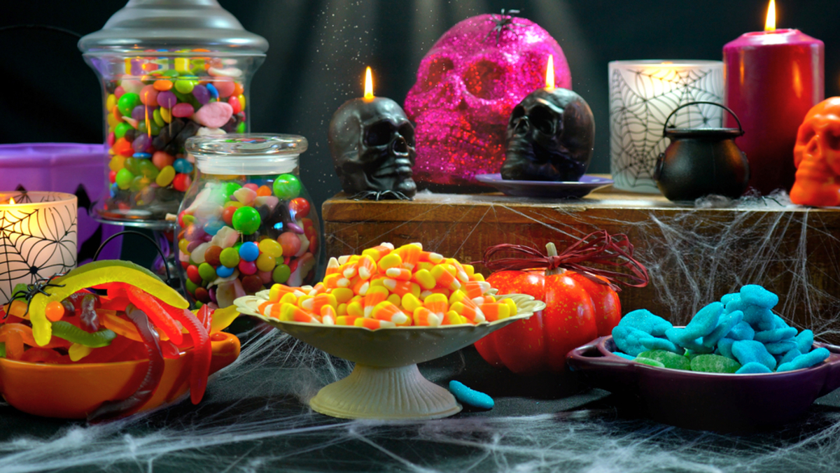 table filled with bowls of Halloween candy 