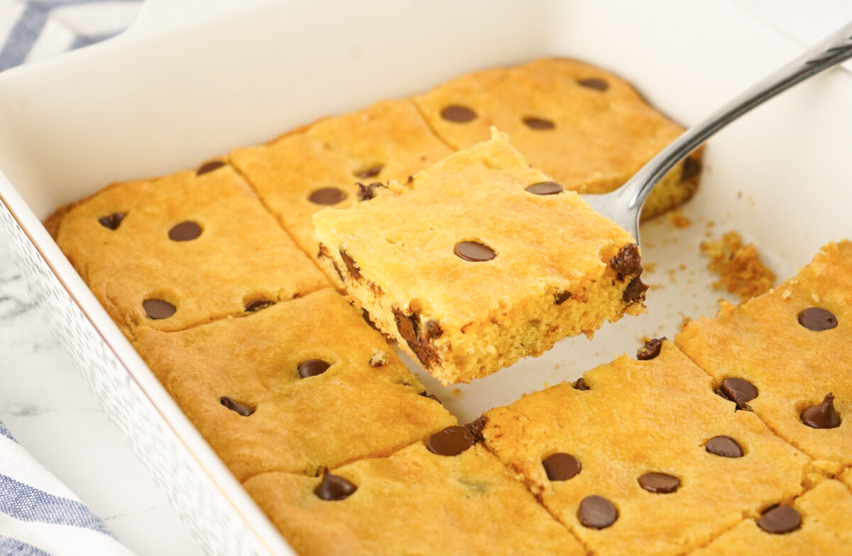 removing cake mix cookie bars from the baking dish